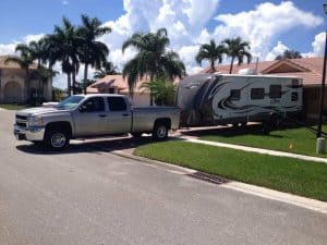 silver truck and travel trailer