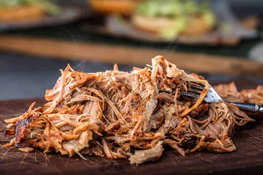 pile of yummy pulled pork on a board