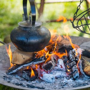 Cooking a kettle over a campfire to make easy RV meals