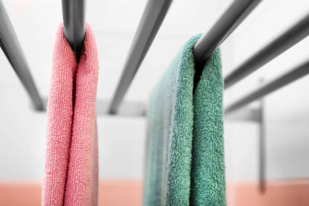 towels hanging on rv towel rack in bathroom