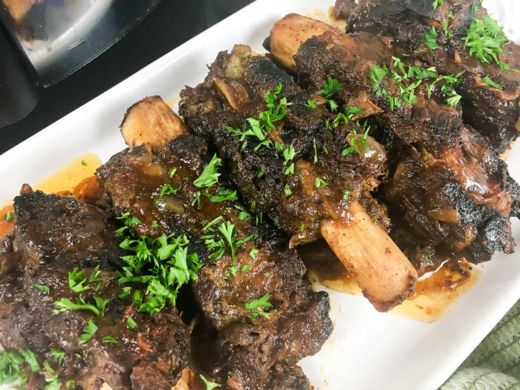 Slow cooker baby back ribs served on plate
