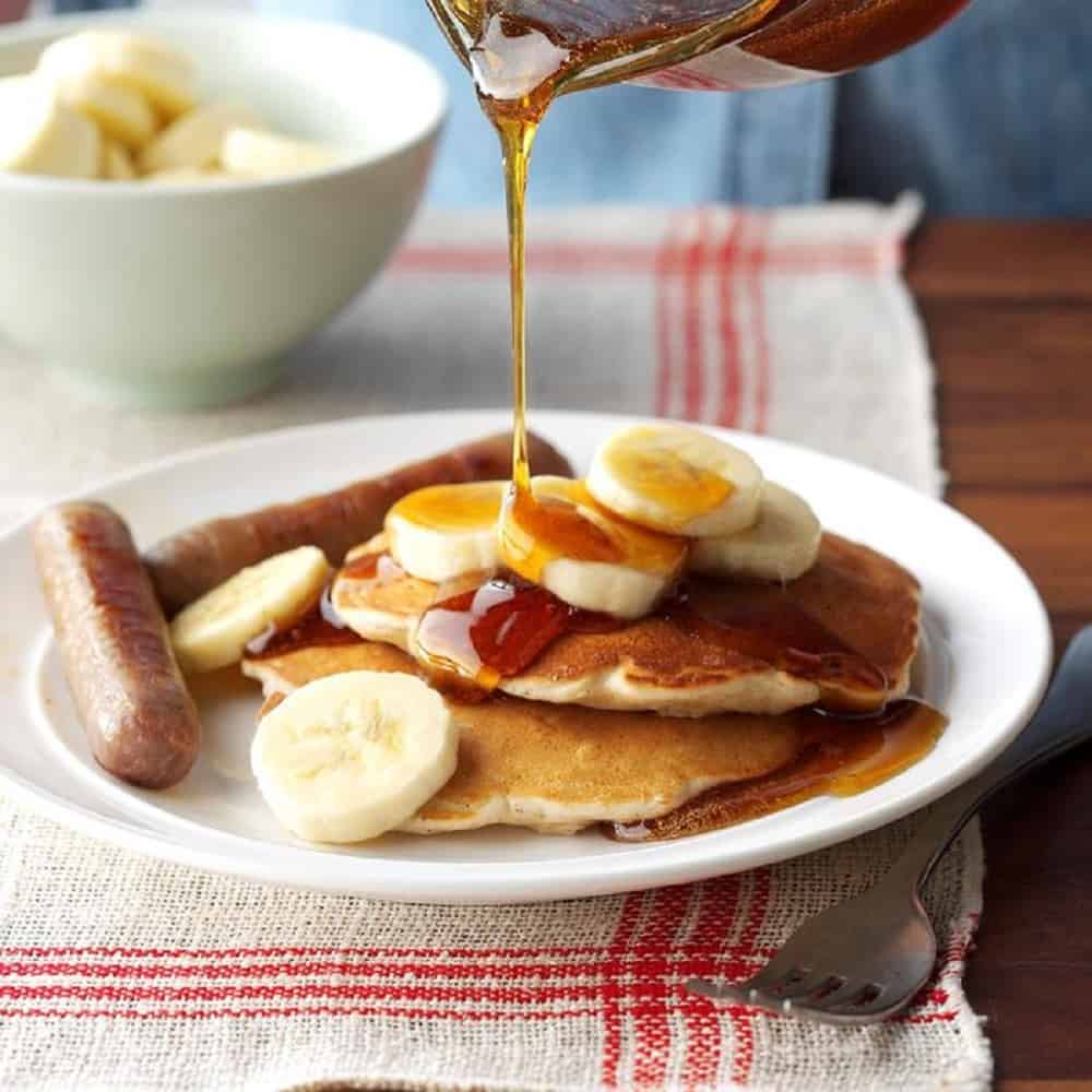 plate of pancakes with bananas