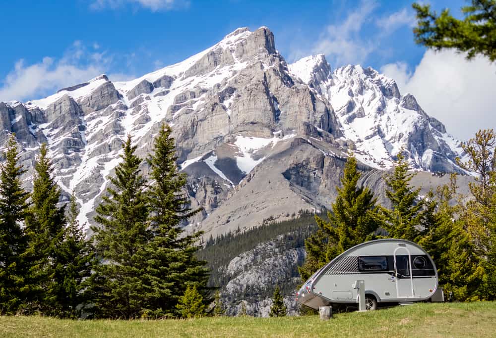 teardrop camper in front of mountains