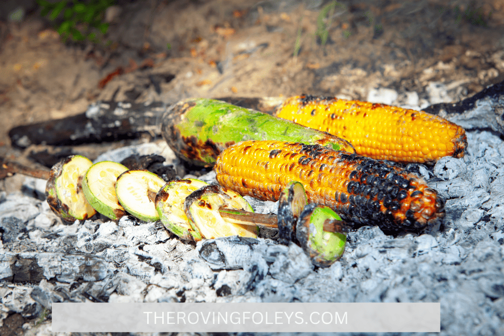 corn on the cob on open coals