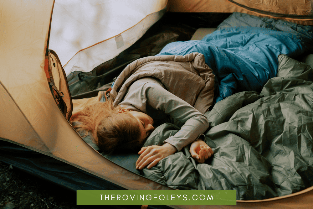 child sleeping in a tent