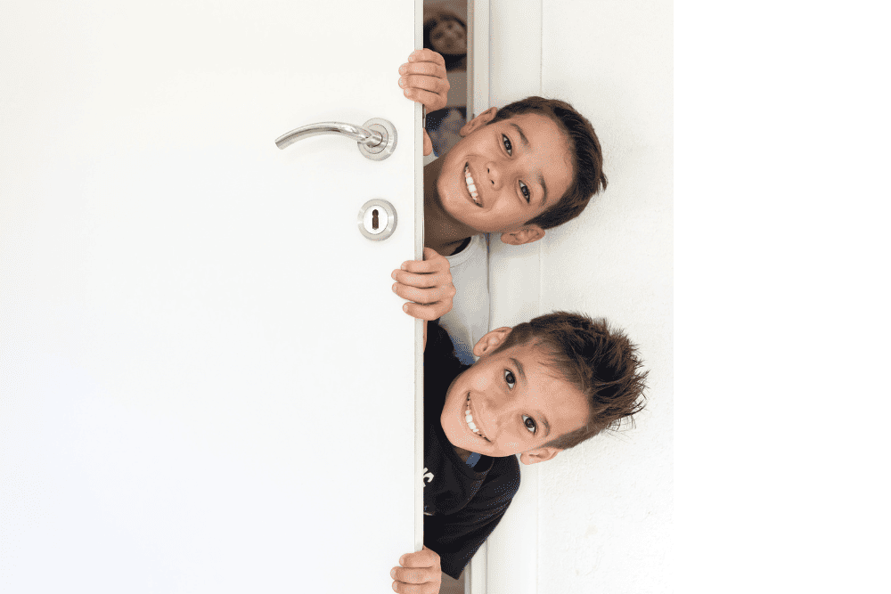 kids peeking into rv bedroom door