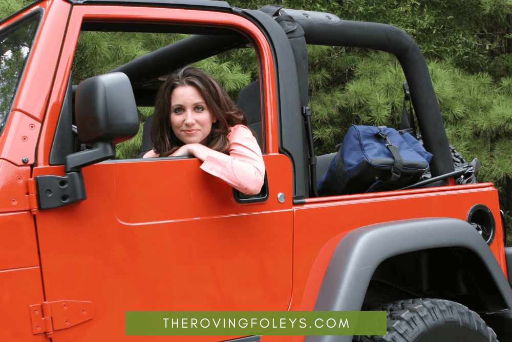 girl in jeep smiling