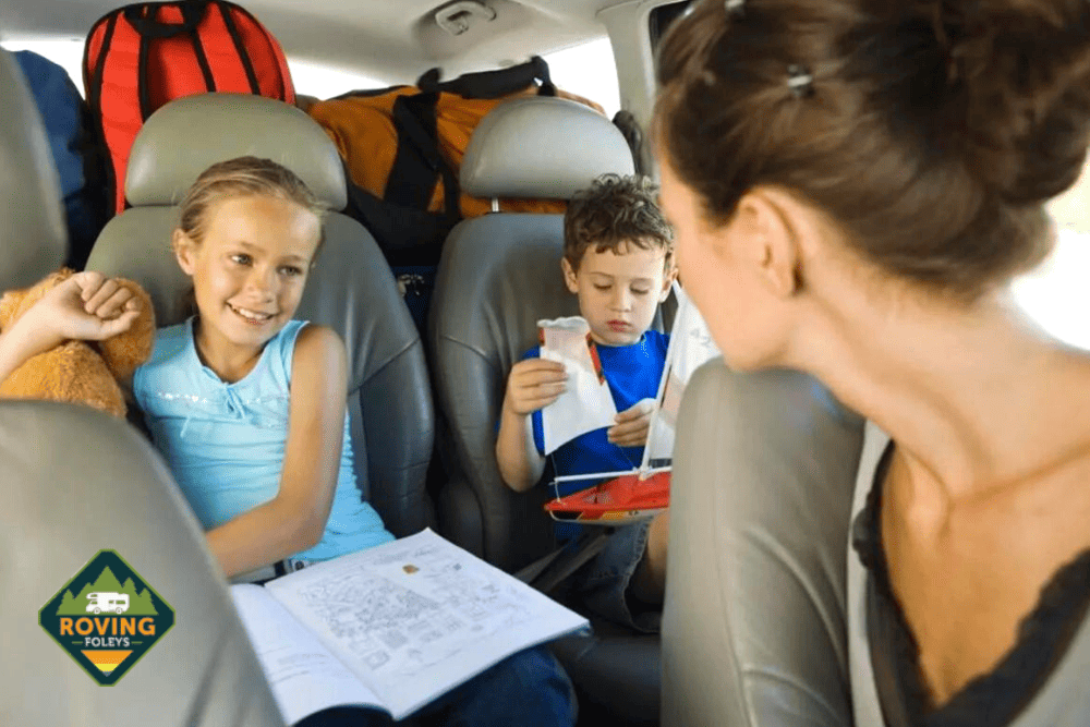 family in car with activities