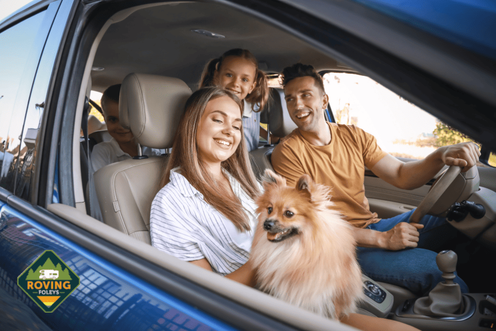 family and dog in car