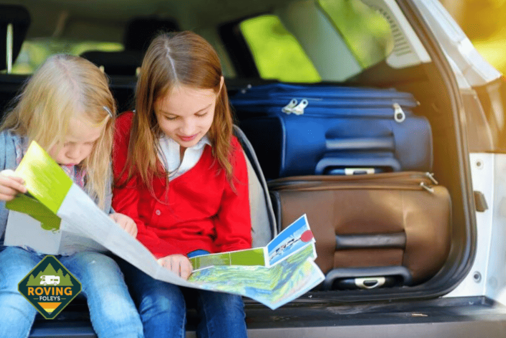 girl reading a map in car