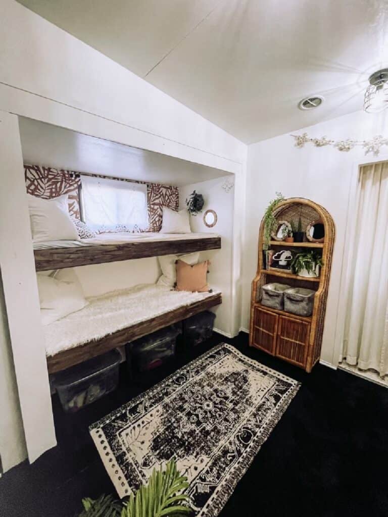 bunk room with balck and white rug
