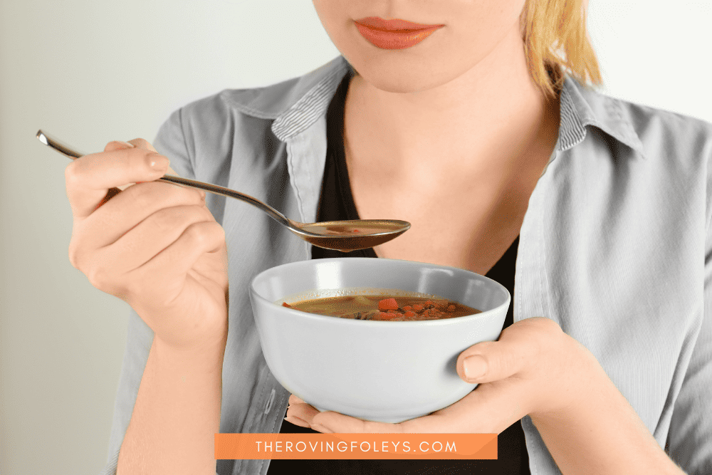 woman eating stew