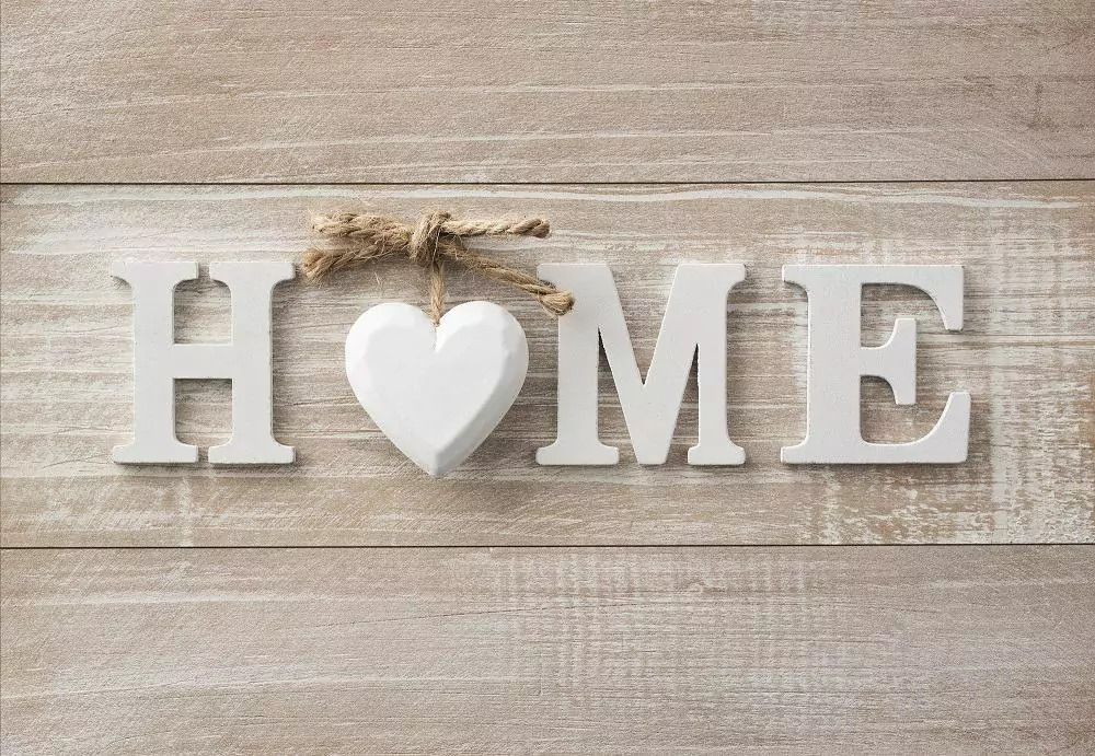 A home sign with a heart in the middle to hang on your wall